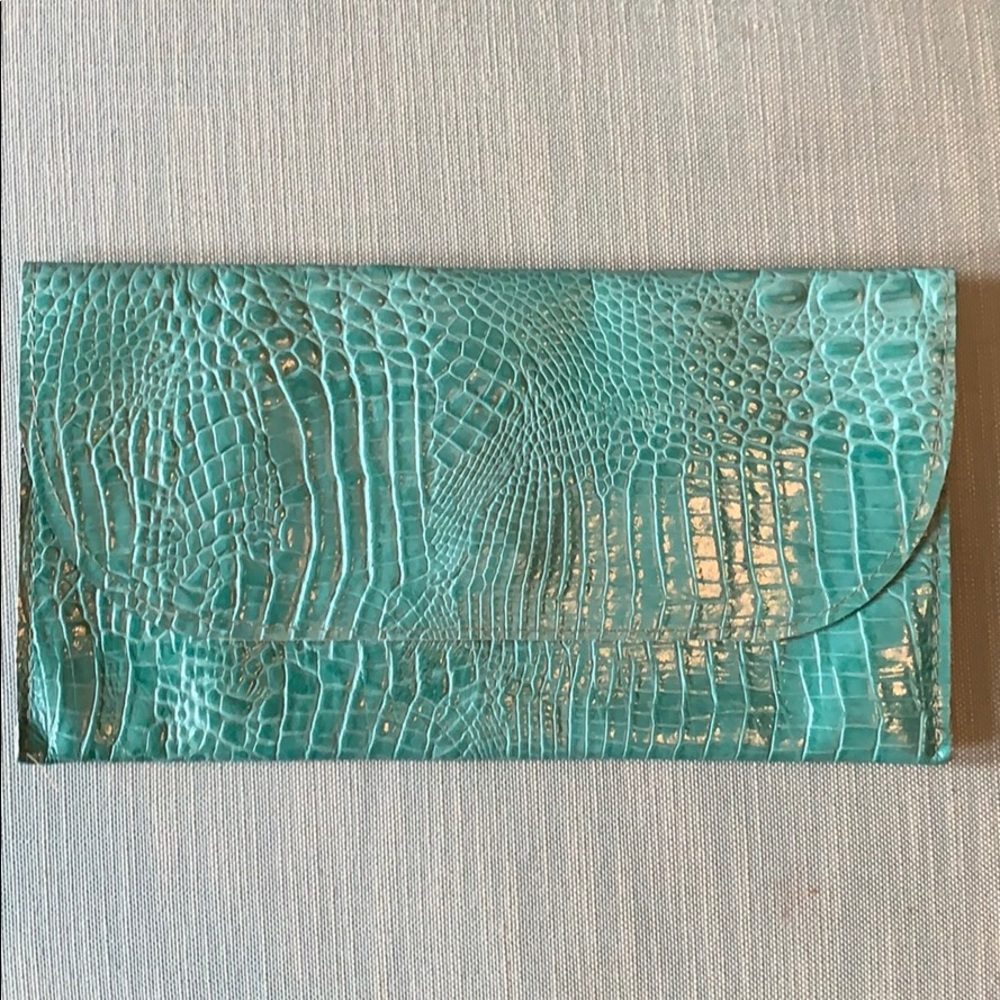 Satchel. turquoise leather crocodile print clutch